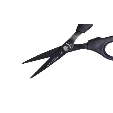 A pair of black hair scissors with silver metal blades, shown on a plain white background. The brand 'NOTA' is visible on the pivot screw, and 'HAIR SCISORS' is printed on the blade.